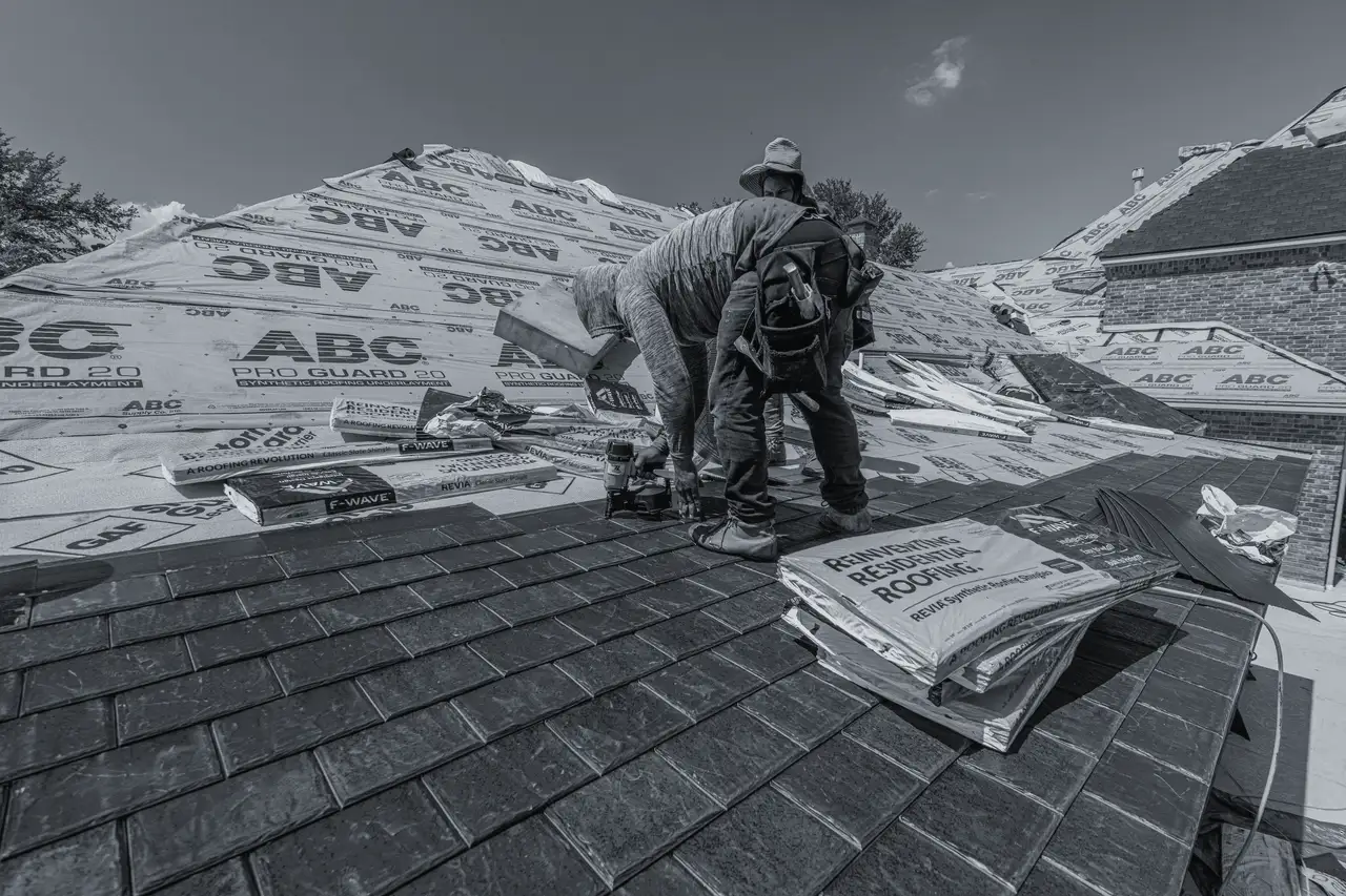 After: new roof being installed over fresh underlayment